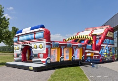 wholesale Big inflatable firetruck bounce house with slide suppliers
